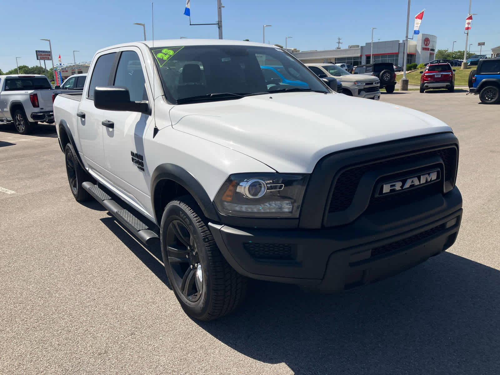 2023 RAM 1500 Classic Warlock in Bright White Cl — front three-quarter view