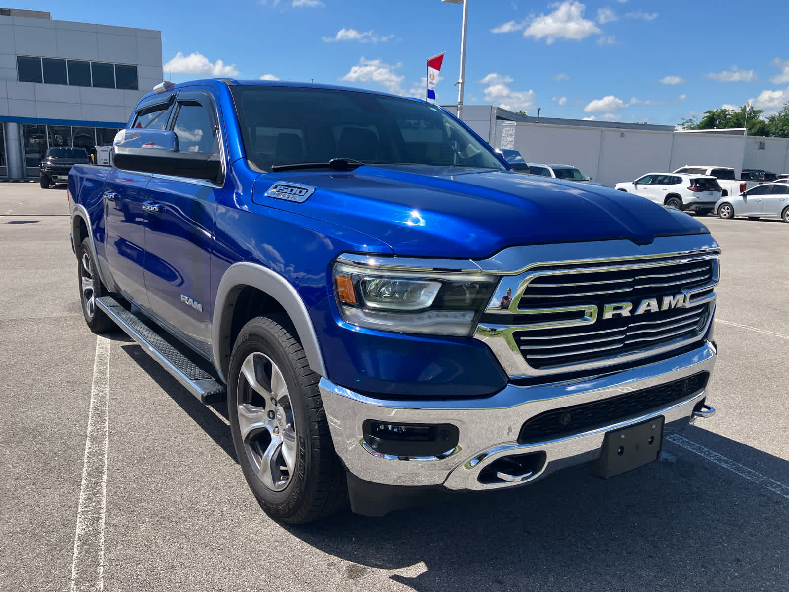 2019 RAM 1500 Laramie in Blue Streak Pea — front three-quarter view