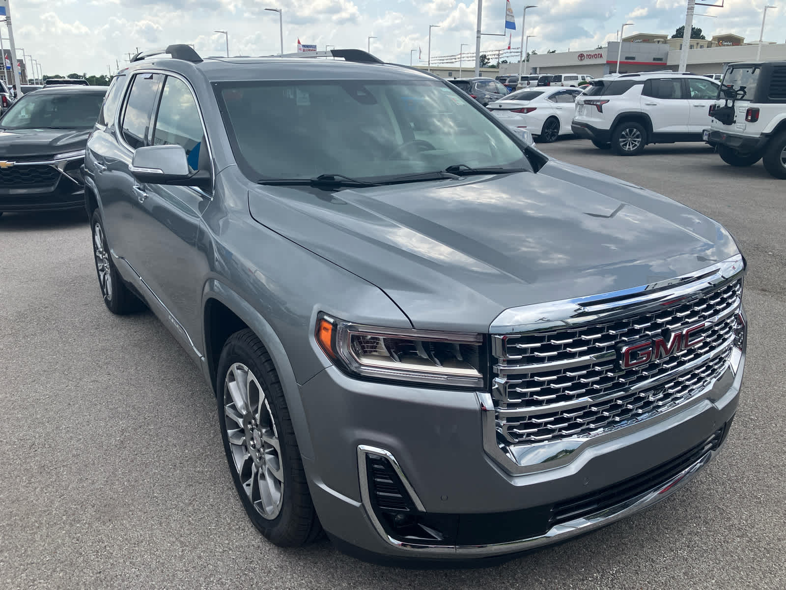 2023 GMC Acadia Denali in Sterling Metallic — front three-quarter view