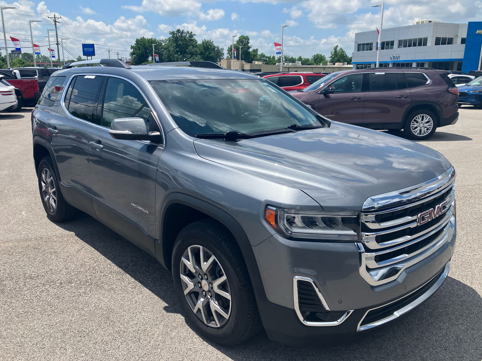 2021 GMC Acadia SLT in Satin Steel Metallic — front three-quarter view