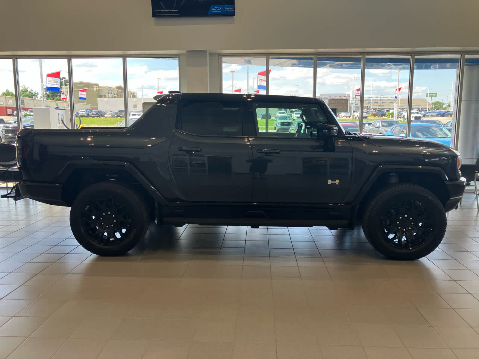 2026 GMC HUMMER EV Pickup 2X in Graphite Blue Metallic — front three-quarter view
