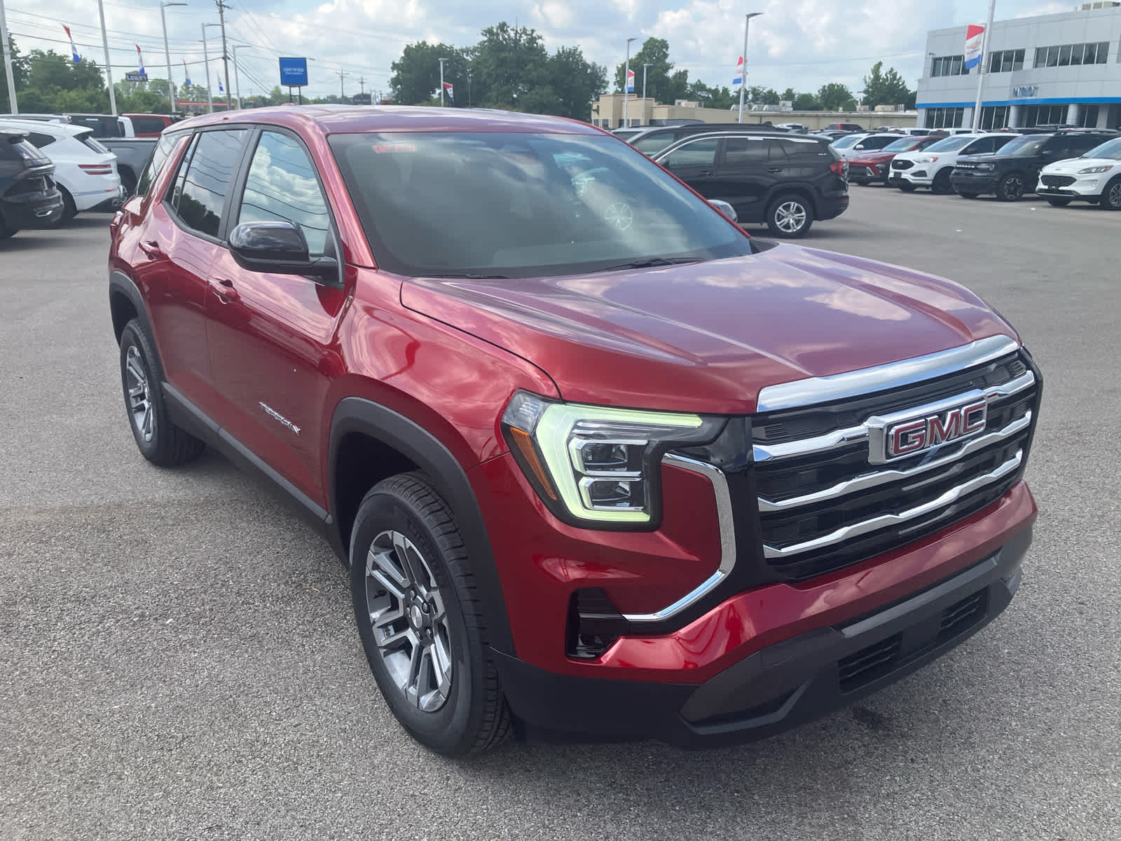 2026 GMC Terrain Elevation in Volcanic Red Tintcoat — front three-quarter view