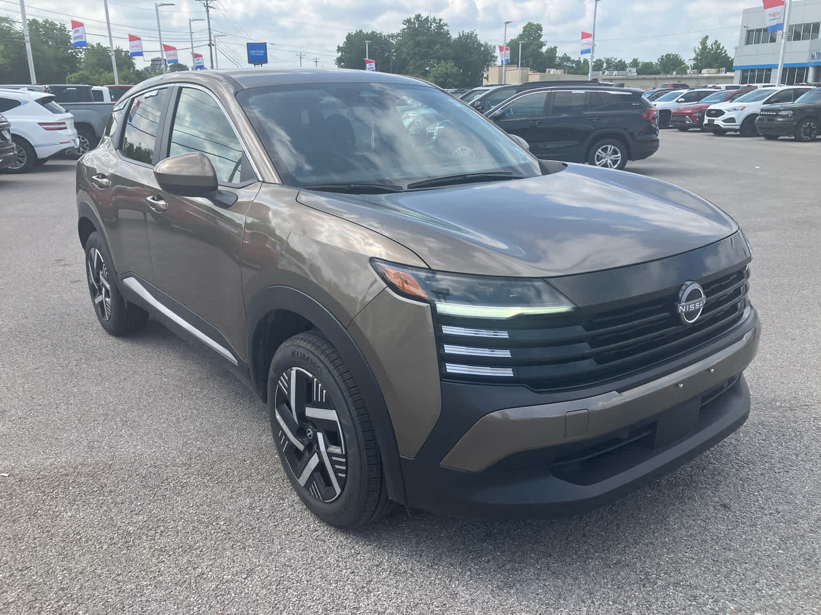 2025 Nissan Kicks SV in Canyon Bronze M — front three-quarter view
