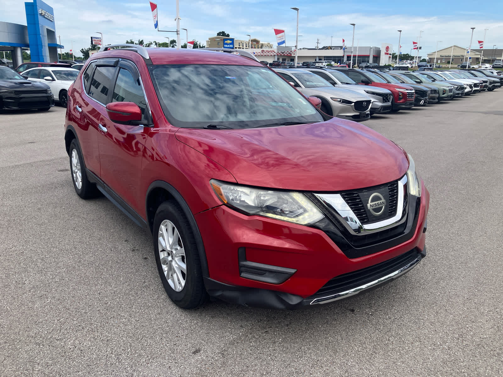 2017 Nissan Rogue SV in Palatial Ruby — front three-quarter view