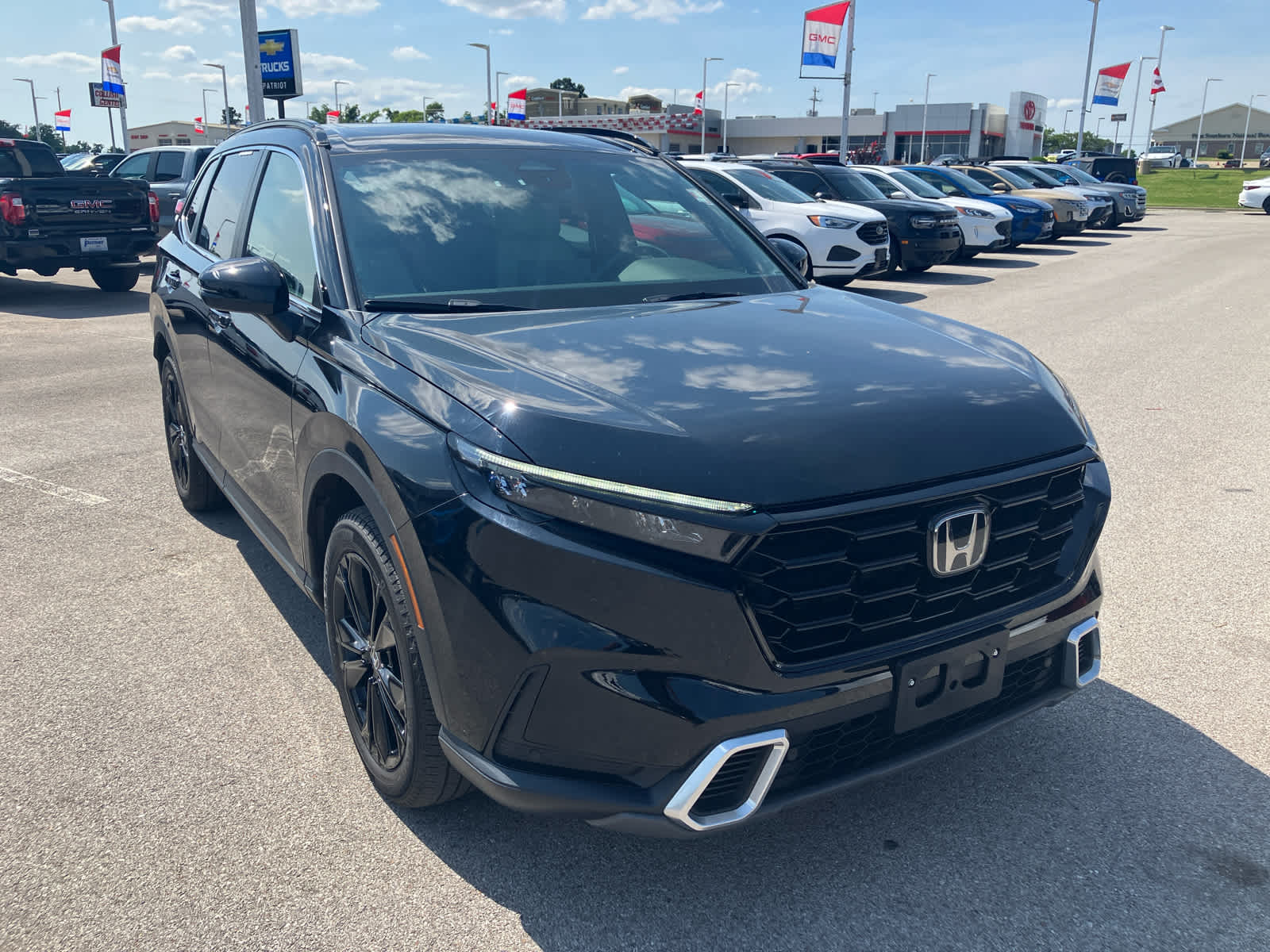 2024 Honda CR-V Hybrid Sport Touring in Other — front three-quarter view