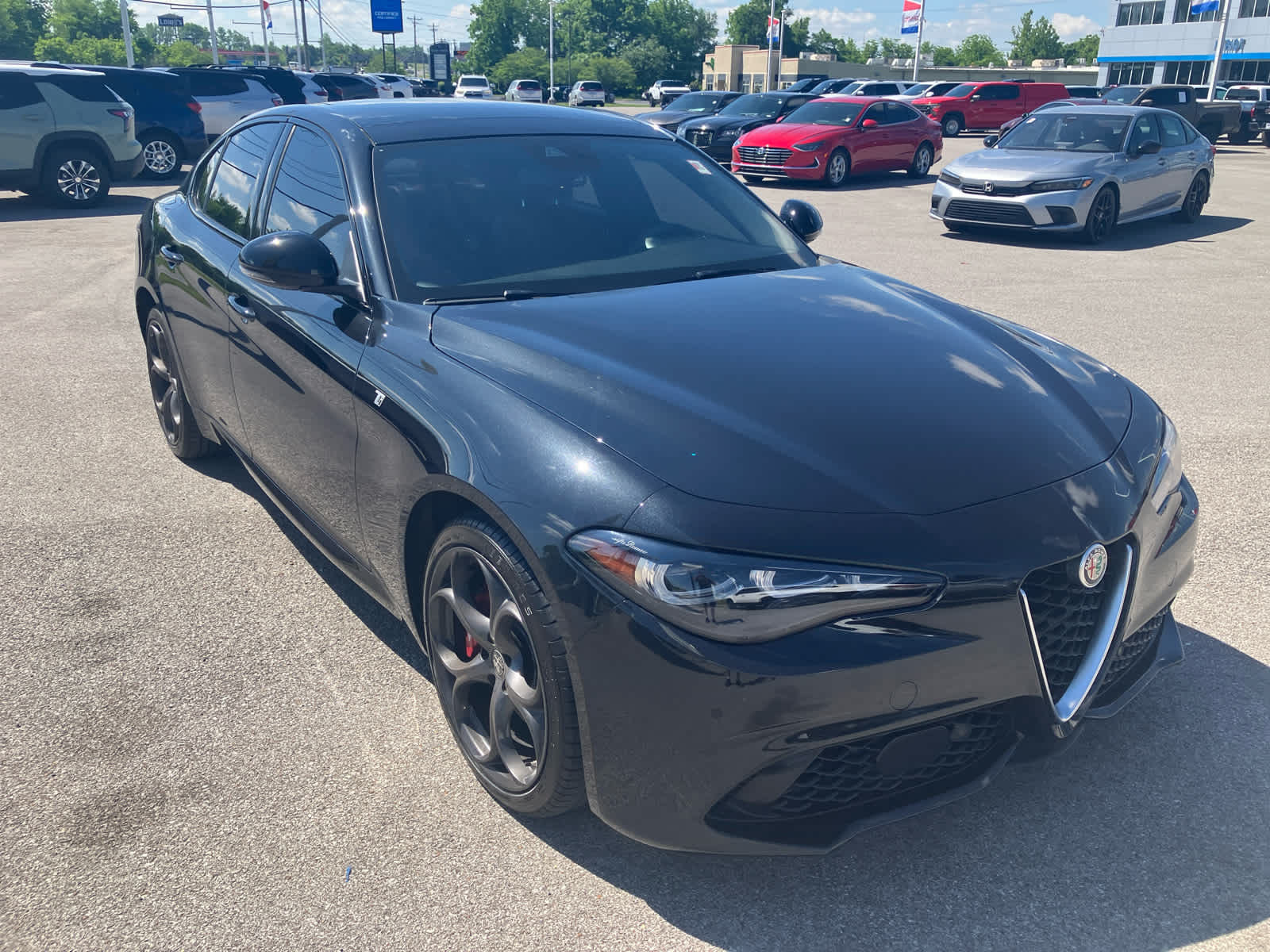 2024 Alfa Romeo Giulia Ti in Vulcano Black M — front three-quarter view